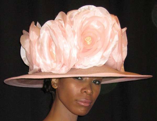 Which of these designers was well known for hats and millinery?