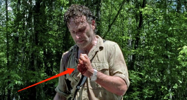 Does Rick cut Carl’s arm off?