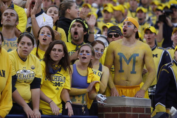 What do Michigan State fans yell during fight song?