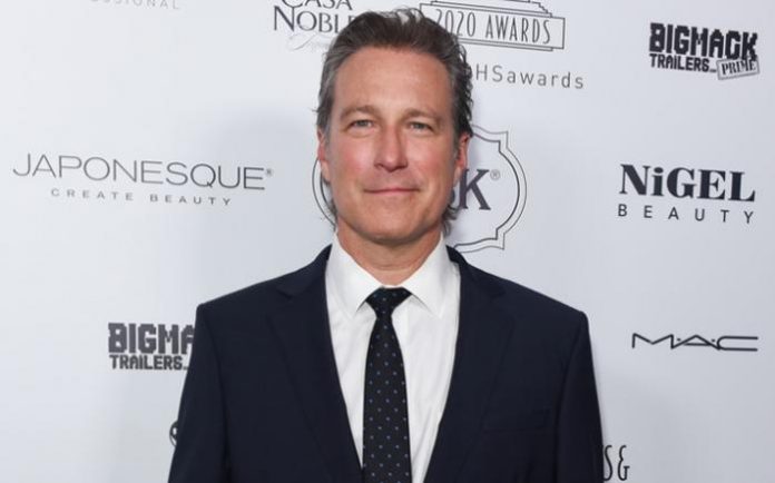 What nationality is John Corbett?