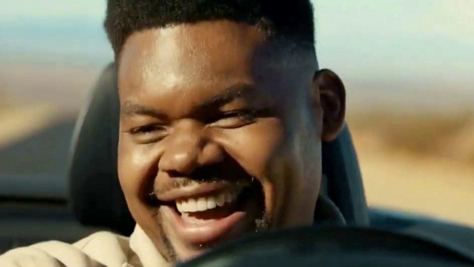 Who is the guy driving the car singing in the Allstate commercial?