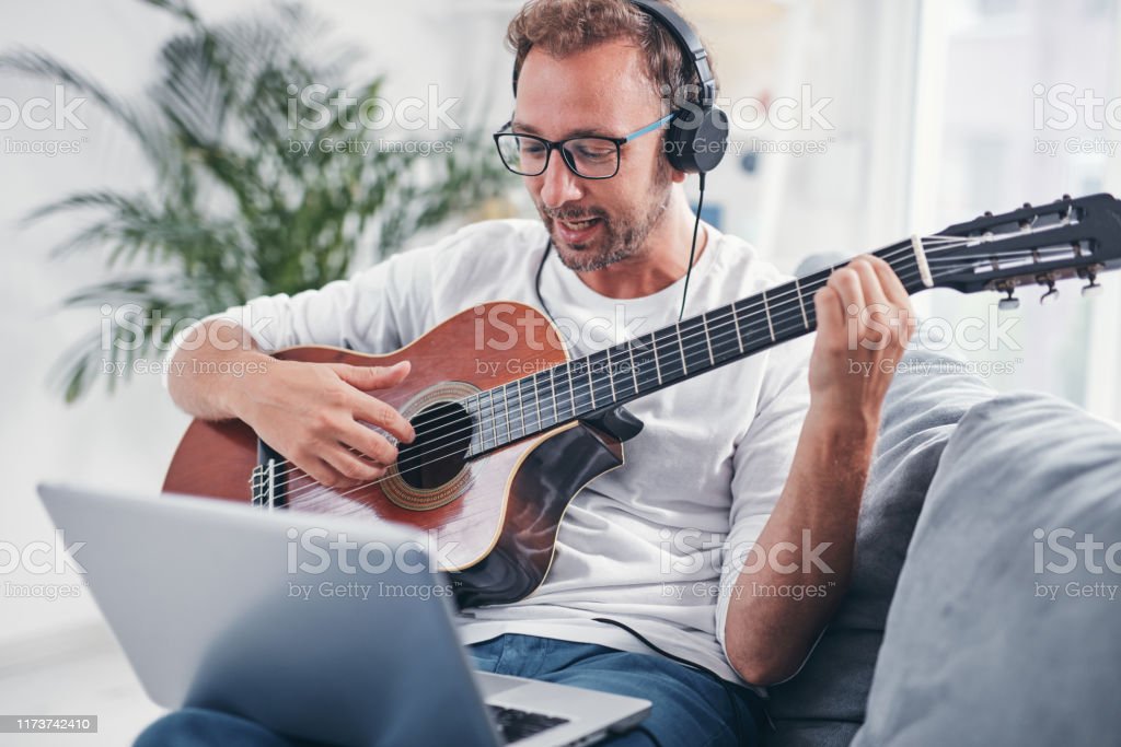 Who is the guy playing guitar in the TurboTax commercial?