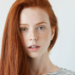 Who is the red haired girl in the Grammarly commercial?