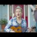 Who sings the song searching in the Verizon commercial?